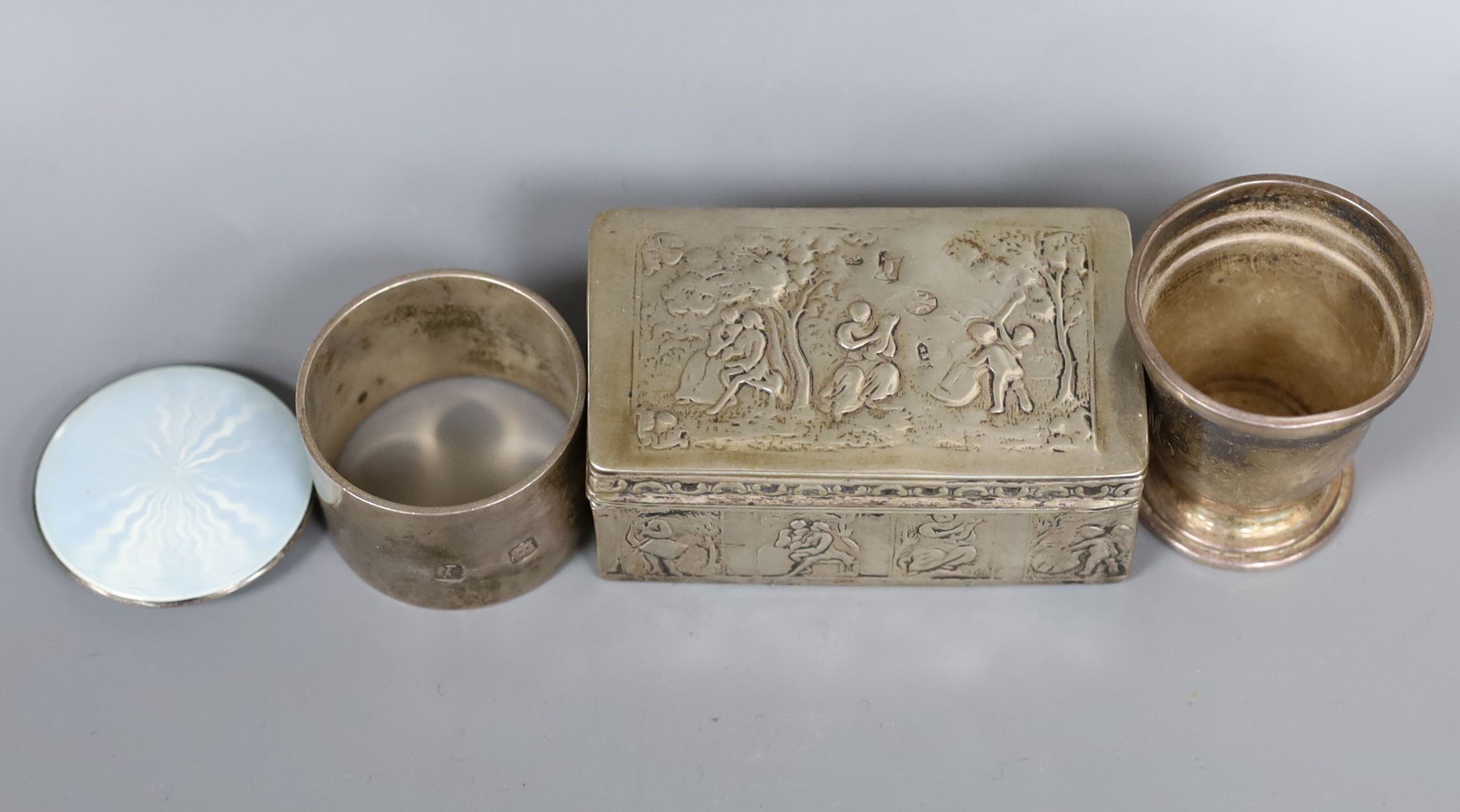 A late 19th century Dutch? white metal rectangular box and cover, 83mm, a small silver cup, a silver napkin ring and a silver and enamel small circular compact.